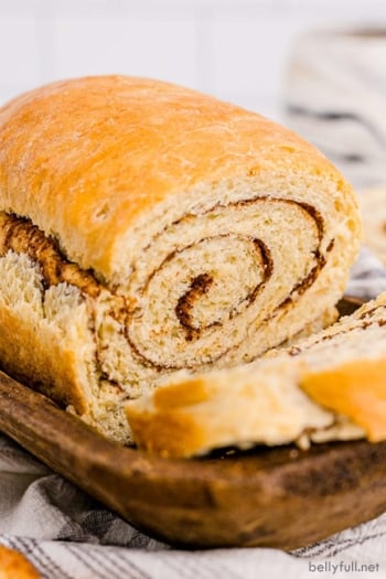 loaf of cinnamon swirl bread with a slice removed