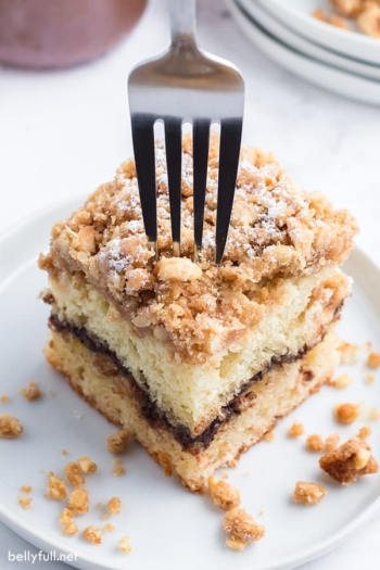 fork inserted into a slice of coffee cake