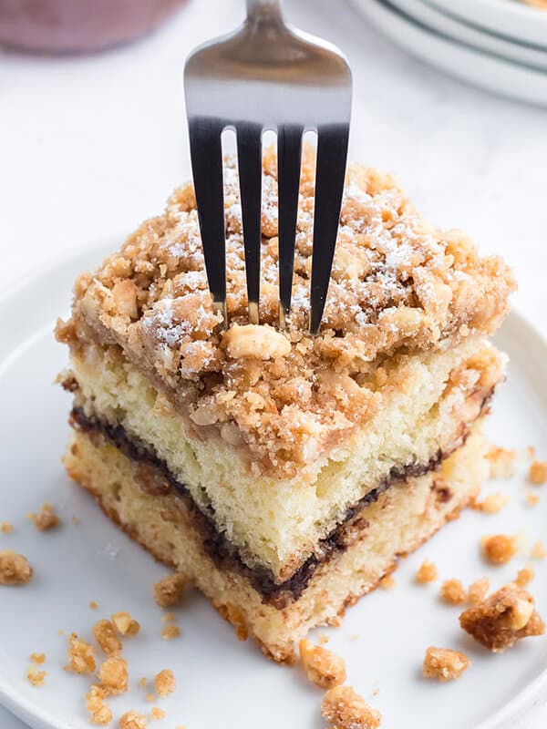 fork inserted into a slice of coffee cake