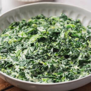 A big white bowl of creamed spinach
