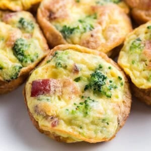 Close up baked egg muffin with broccoli and bacon
