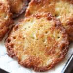 close up golden and fried potato latke on paper towel