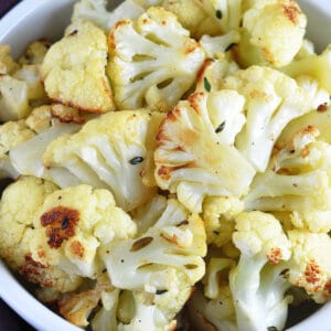 bowl full of golden roasted cauliflower florets