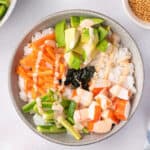 overhead sushi bowl with carrots, cucumber, avocado, and crab