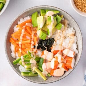 overhead sushi bowl with carrots, cucumber, avocado, and crab
