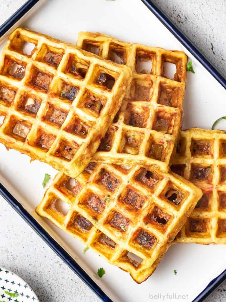 4 cheese and egg waffles on white serving tray