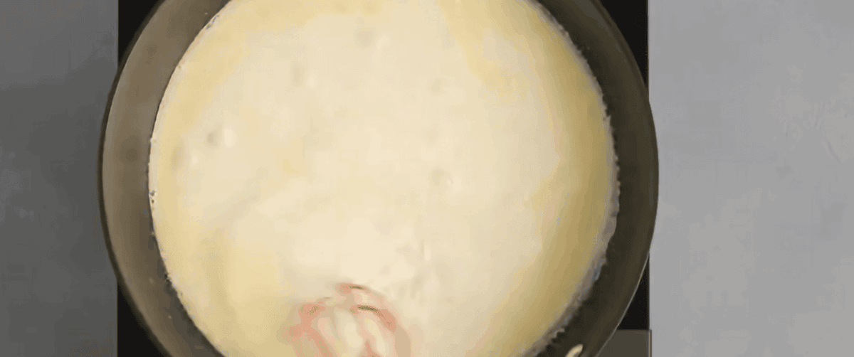 Combining butter and cream in a skillet. 