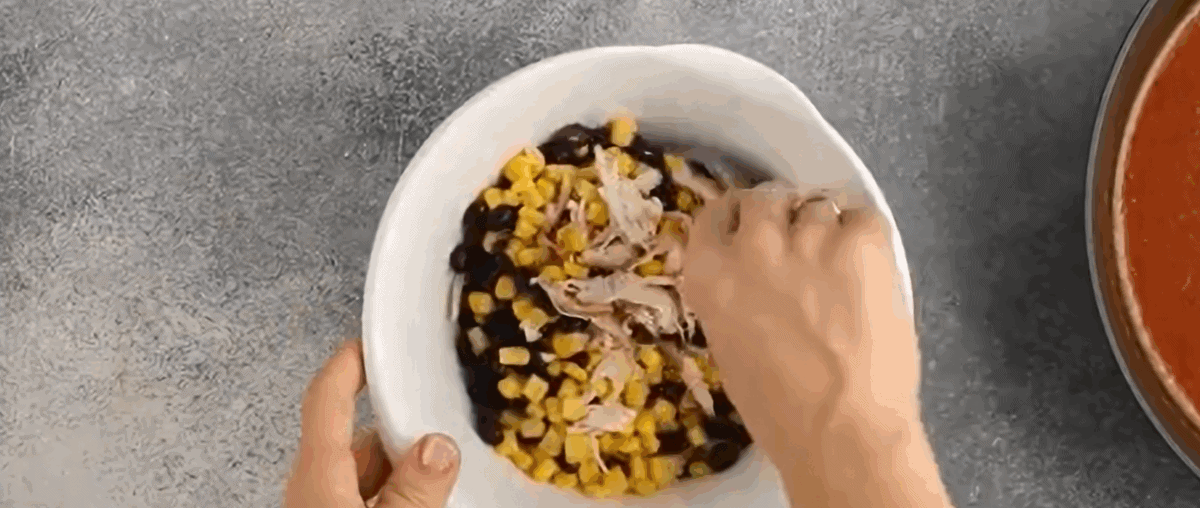 Preparing the enchilada filling.