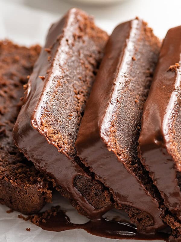 close up slices of glazed chocolate pound cake