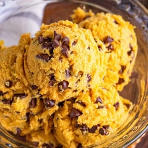 A bowl of scoops of pumpkin edible cookie dough