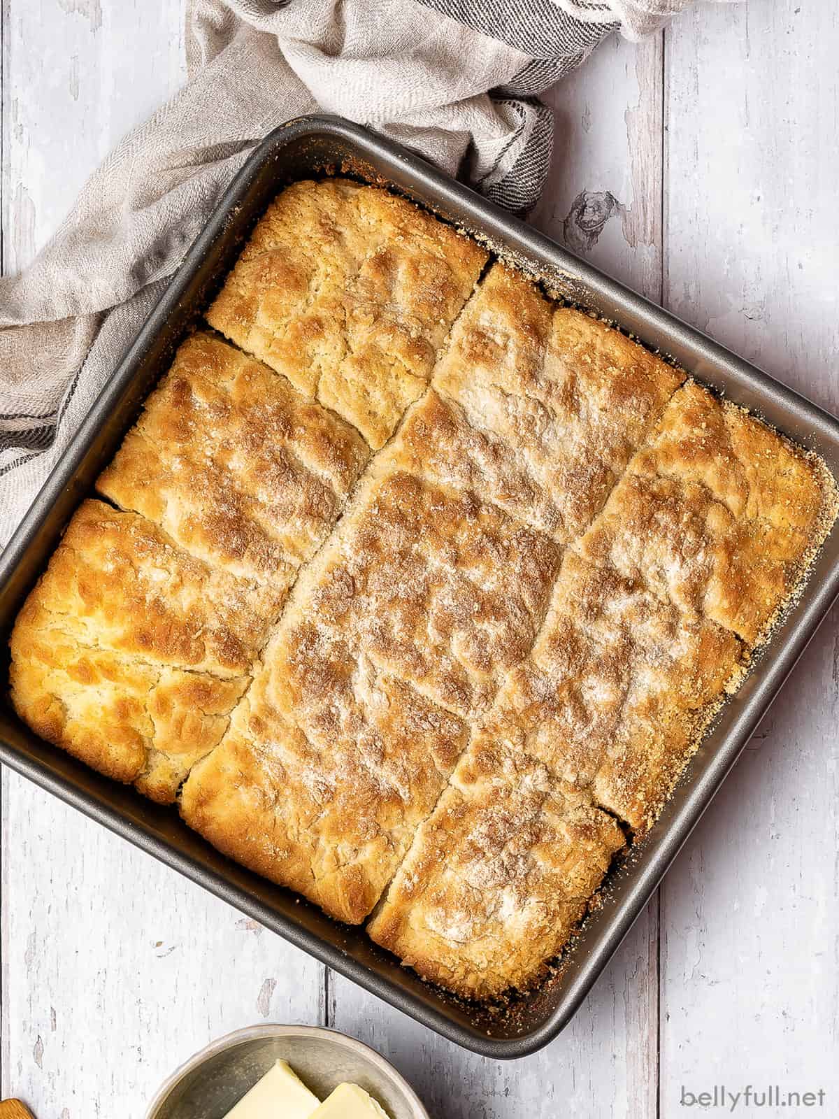 Overhead view of a square dish of 7-up biscuits