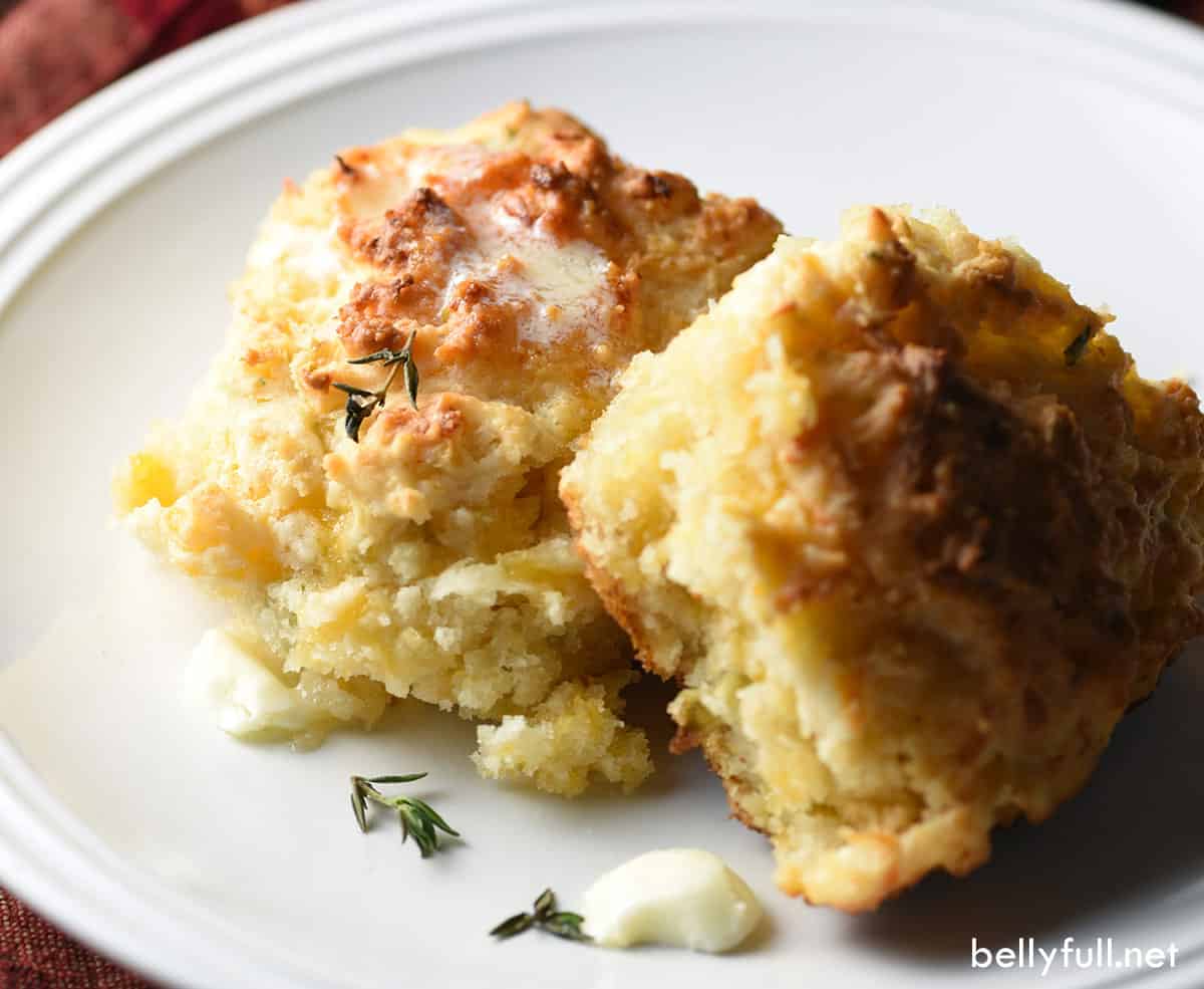 2 apple cheddar biscuits on white plate