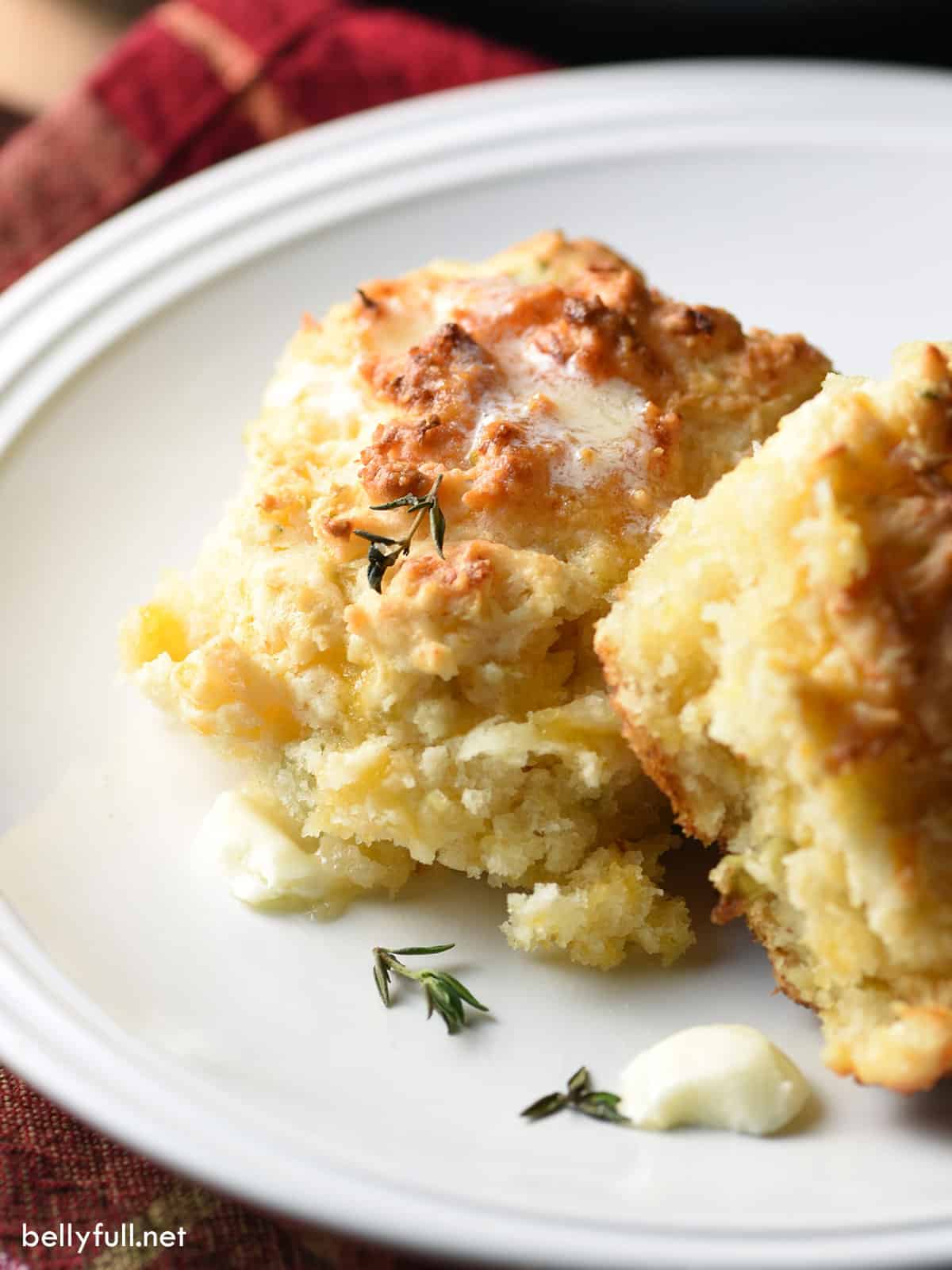 2 apple cheddar drop biscuits with melted butter