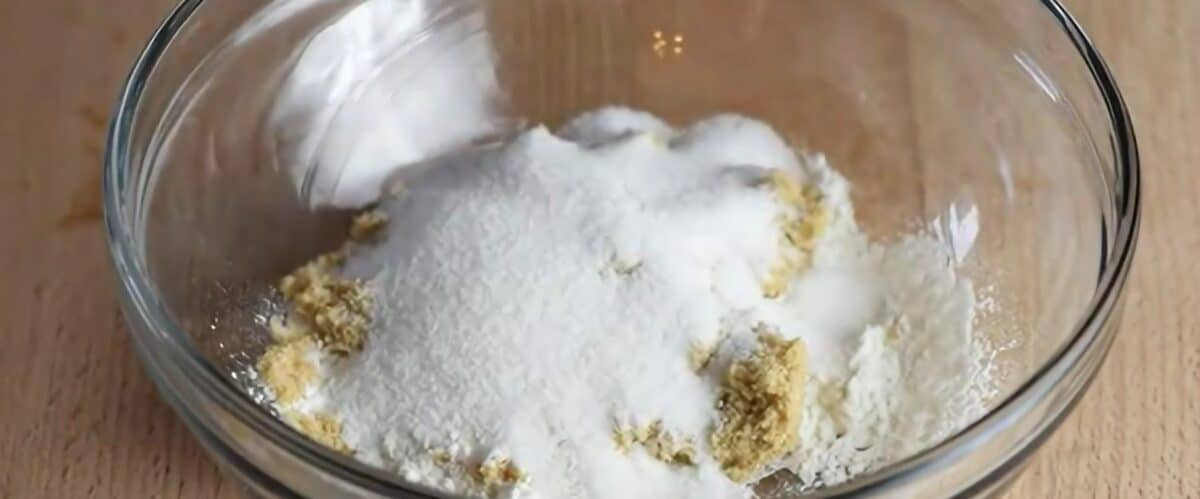 Combining the ingredients for the topping in a glass bowl.