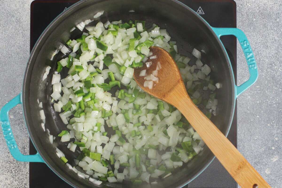 Cooking an onion and a poblano pepper.