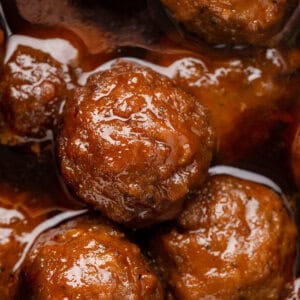 A close-up of crockpot grape jelly meatballs