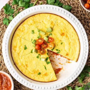 over head thick omelet pie with cherry tomatoes sliced into wedges