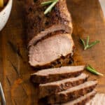 sliced roast pork tenderloin with fresh rosemary