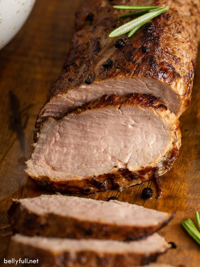 sliced roasted pork tenderloin with fresh rosemary