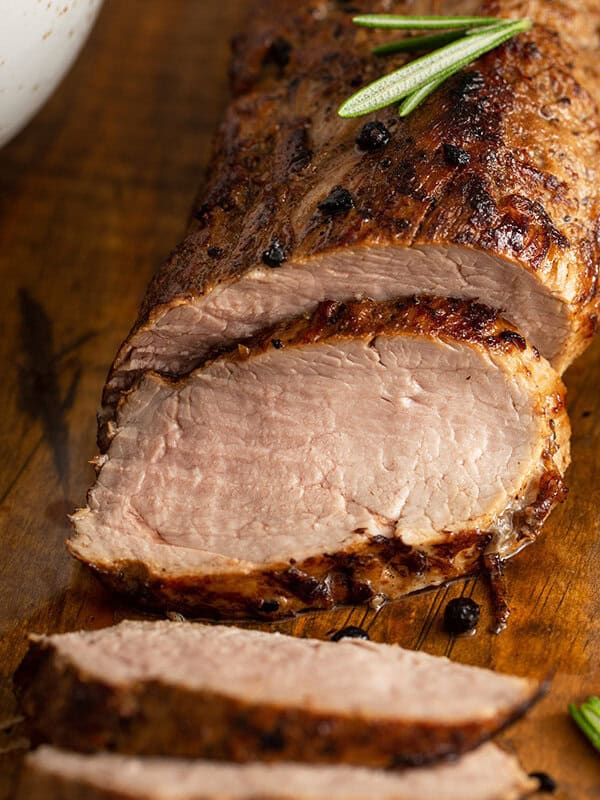 sliced roasted pork tenderloin with fresh rosemary