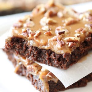 2 squares of caramel brownies stacked