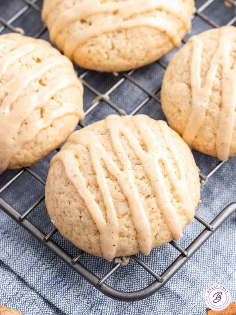 close up glazed eggnog cookie on cooling rack