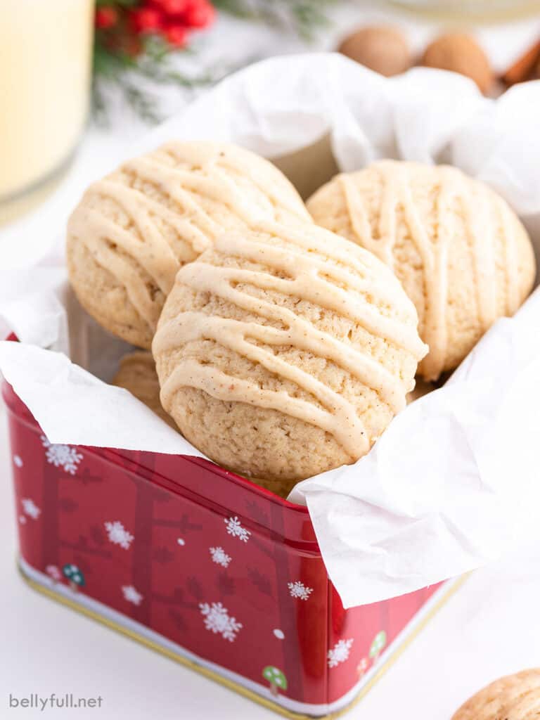 eggnog cookies with icing in christmas tin