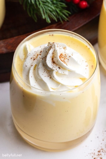 An eggnog cocktail with whipped cream