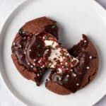 overhead hot chocolate cookie cut in half with gooey marshmallow