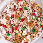 Overhead view of a large bowl of Christmas chex mix