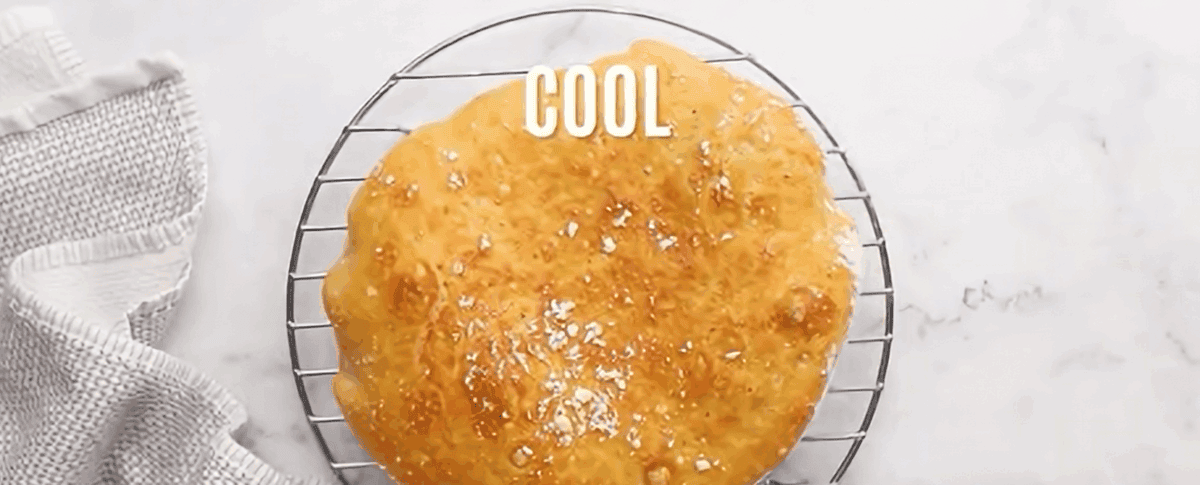 Dutch oven bread on a cooling rack.