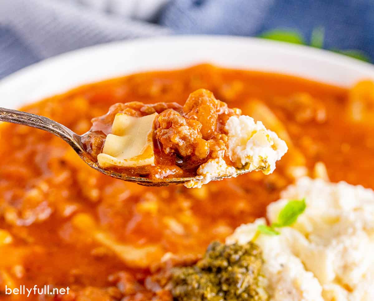 A spoonful of lasagna soup over a bowl