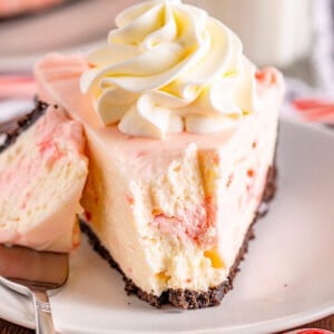 front angle of no bake peppermint cheesecake with bite taken