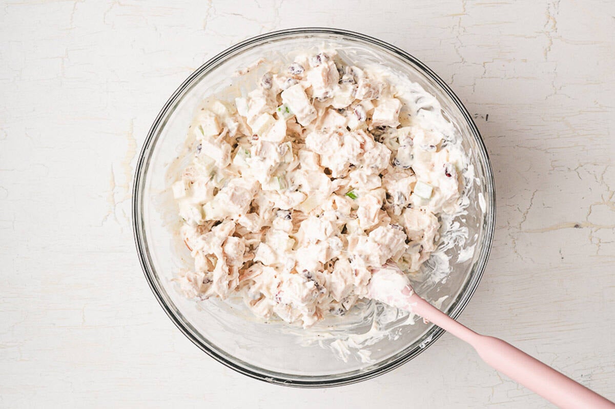 This is the BEST chicken salad recipe. With chicken, cranberries, apples, and pecans, it's wonderful on its own or as a sandwich! Combining the chicken salad ingredients in a bowl