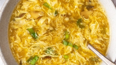 Overhead view of a bowl of homemade egg drop soup