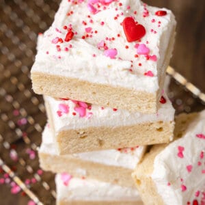 Overhead view of a stack of frosted sugar cookie bars