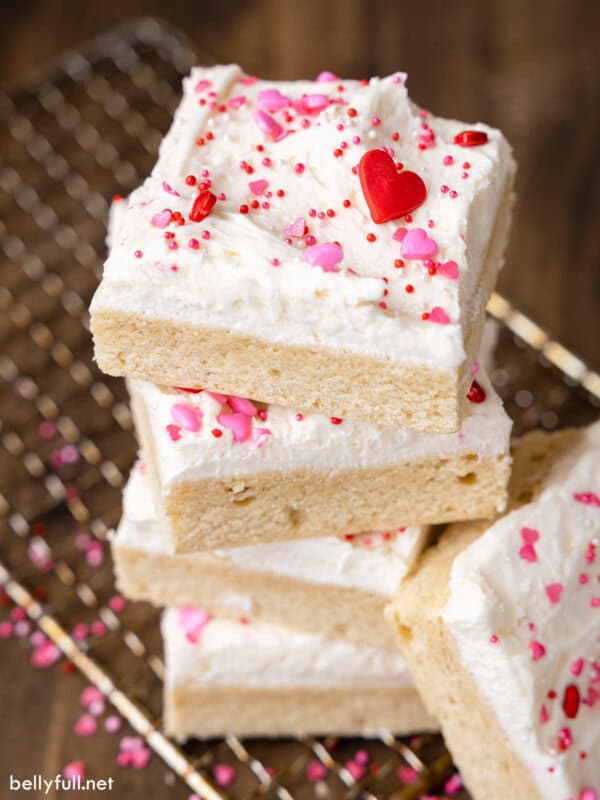 Overhead view of a stack of frosted sugar cookie bars