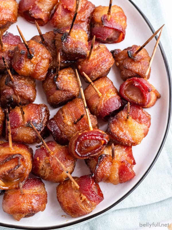 Overhead view of bacon wrapped water chestnuts on a white plate