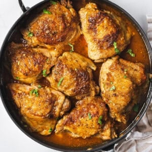 overhead sofrito chicken skin-on thighs in skillet