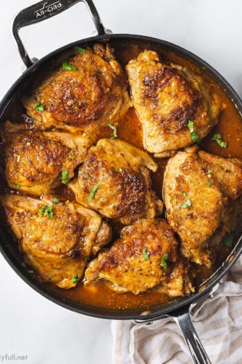 overhead sofrito chicken skin-on thighs in skillet