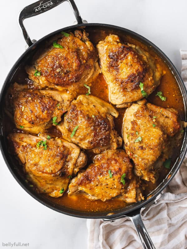 overhead sofrito chicken skin-on thighs in skillet