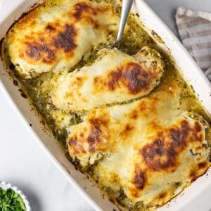 overhead baked salsa verde chicken in white casserole dish