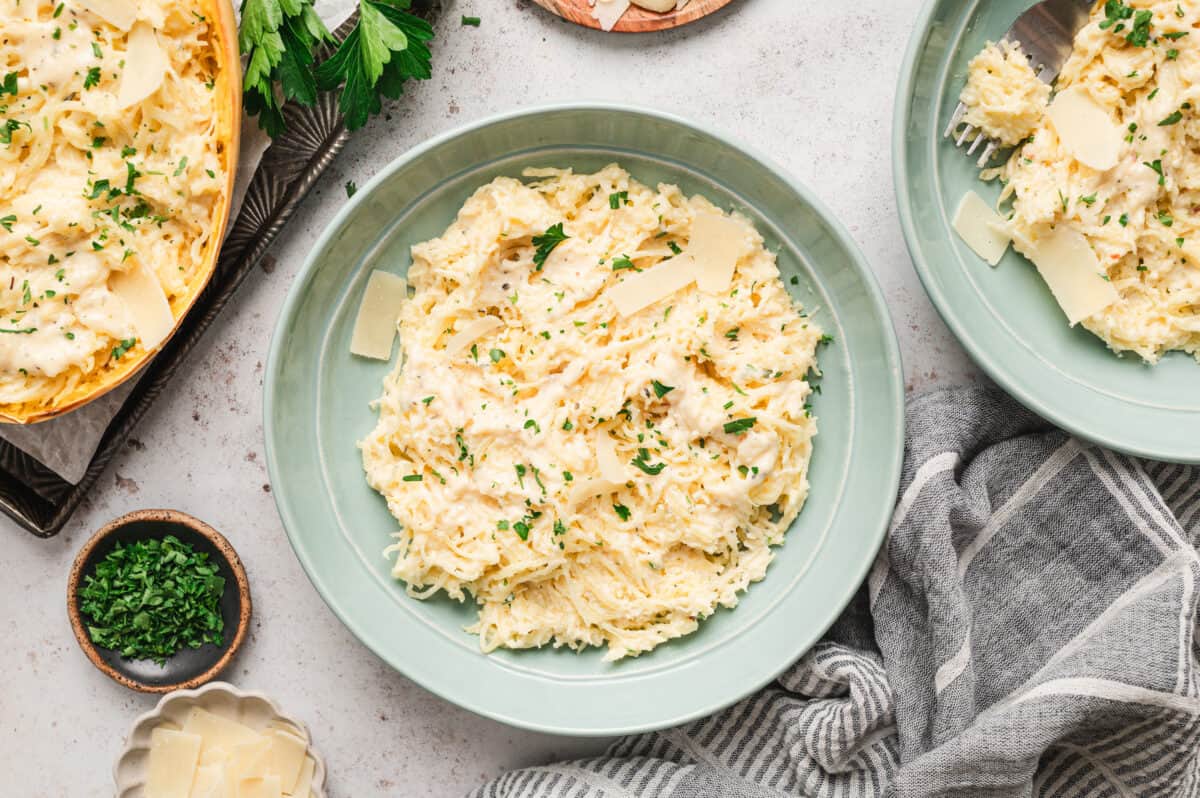 spaghetti squash alfredo on plate with shaved parmesan