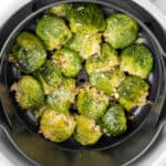 Overhead view of smashed brussels sprouts in the air fryer