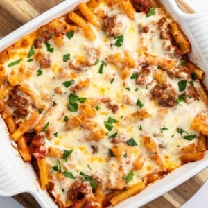 Overhead view of baked ziti in a square casserole dish