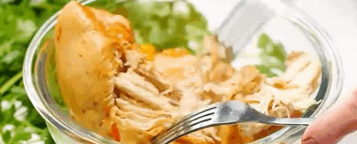 Shredding the chicken with forks. 