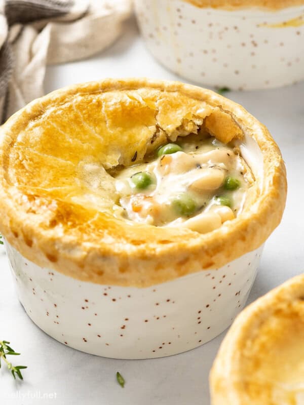 Overhead angled view of a homemade chicken pot pie in a ramekin