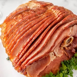 Crockpot spiral ham on a white plate