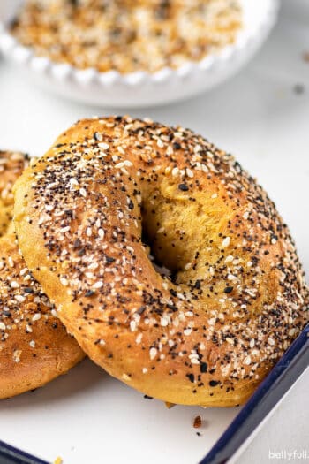 close up bagel coated with everything seasoning