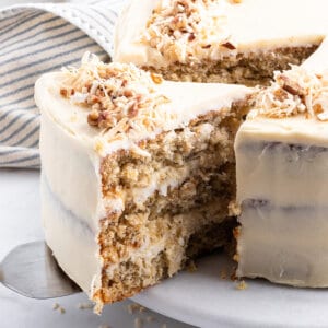 A slice being served from a hummingbird layer cake